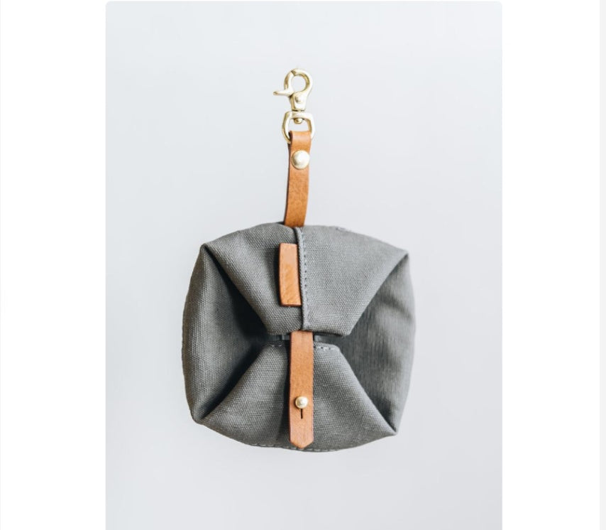 Grey folding travel pet bowl, packed flat