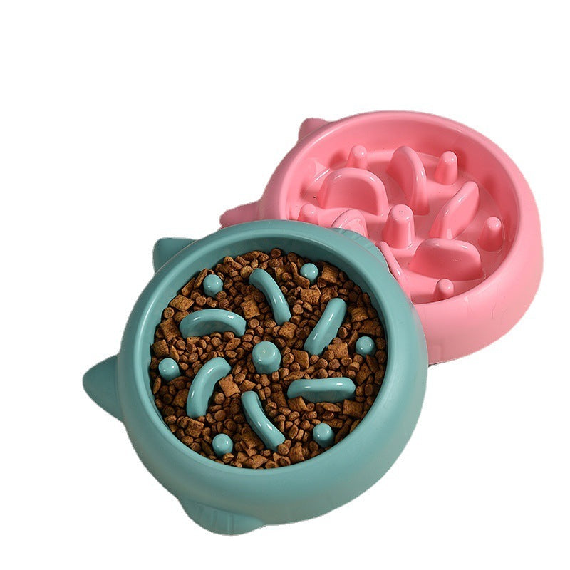 Pink slow feeder bowl filled with kibble