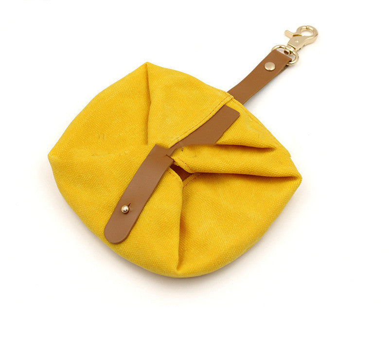 Yellow foldable travel pet bowl with snap strap